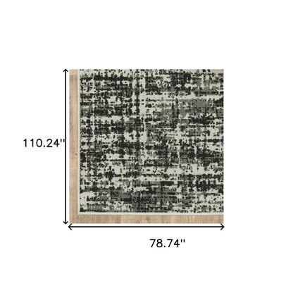 7' X 9' Beige and Black Abstract Stain Resistant Indoor Outdoor Area Rug