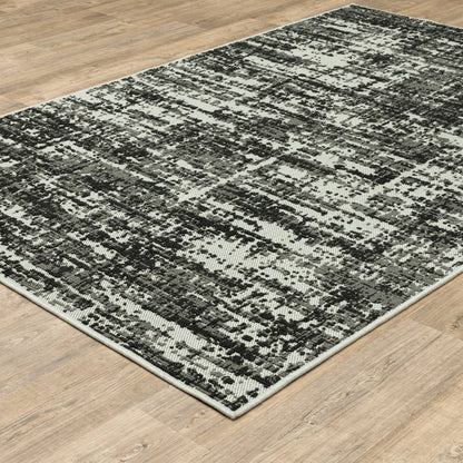 7' X 9' Beige and Black Abstract Stain Resistant Indoor Outdoor Area Rug