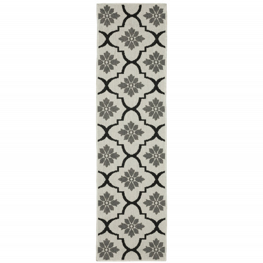 2' X 7' Beige and Black Geometric Stain Resistant Indoor Outdoor Area Rug