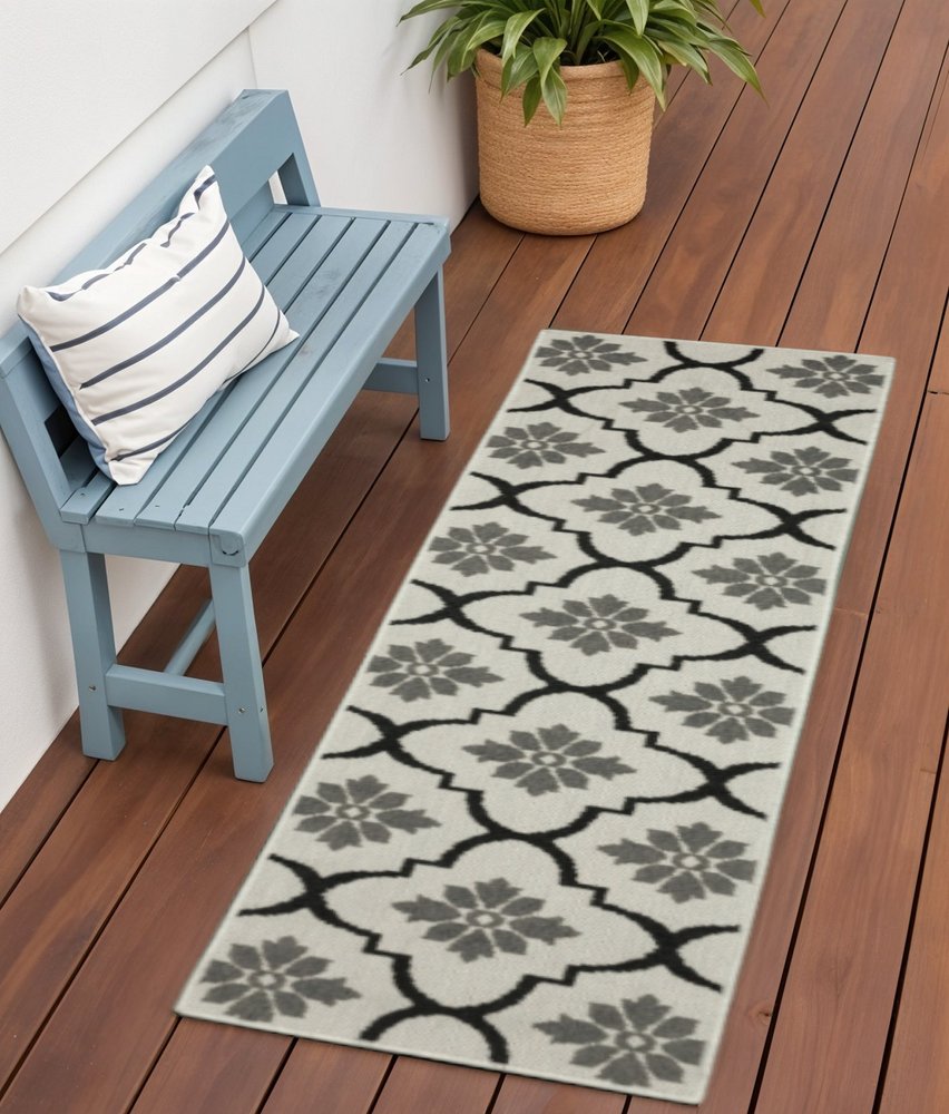 2' X 7' Beige and Black Geometric Stain Resistant Indoor Outdoor Area Rug