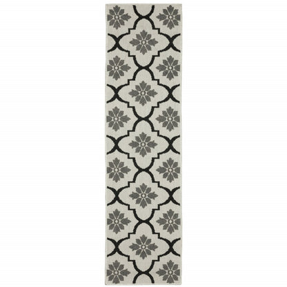 2' X 7' Beige and Black Geometric Stain Resistant Indoor Outdoor Area Rug