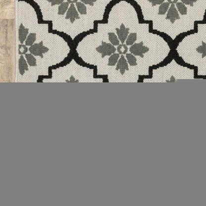 7' X 9' Beige and Black Geometric Stain Resistant Indoor Outdoor Area Rug