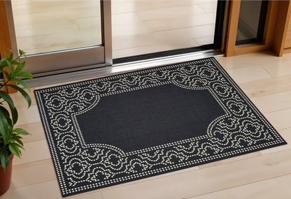 2' X 4' Black and Ivory Stain Resistant Indoor Outdoor Area Rug