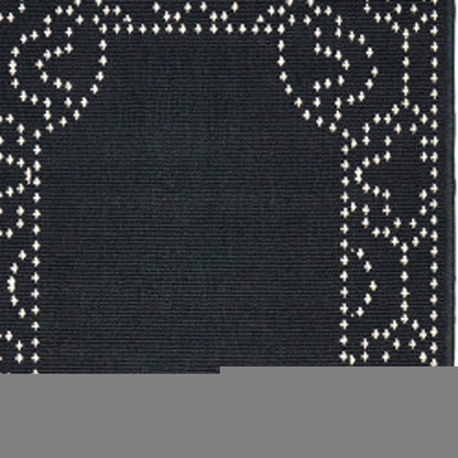 2' X 8' Black and Ivory Stain Resistant Indoor Outdoor Area Rug