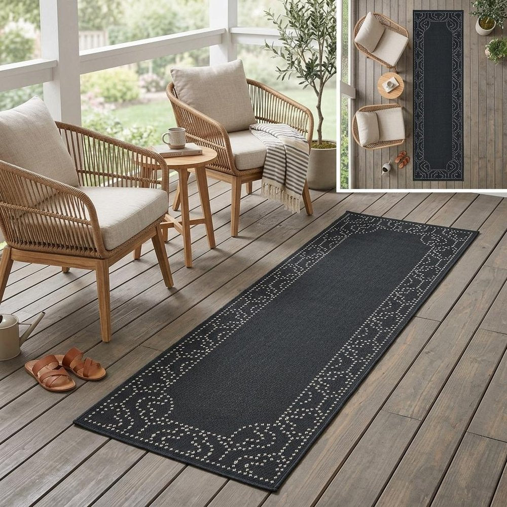 2' X 8' Black and Ivory Stain Resistant Indoor Outdoor Area Rug