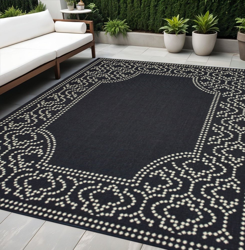 5' X 8' Black and Ivory Stain Resistant Indoor Outdoor Area Rug