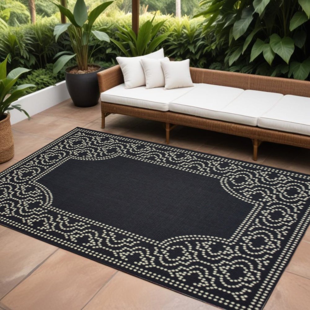 8' X 11' Black and Ivory Stain Resistant Indoor Outdoor Area Rug