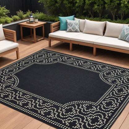 9' X 13' Black and Ivory Stain Resistant Indoor Outdoor Area Rug
