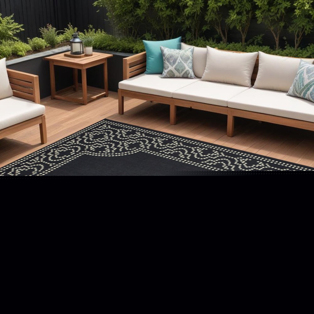9' X 13' Black and Ivory Stain Resistant Indoor Outdoor Area Rug