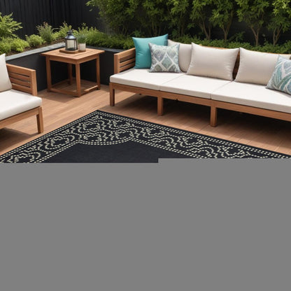 9' X 13' Black and Ivory Stain Resistant Indoor Outdoor Area Rug