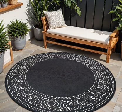 8' X 8' Black and Ivory Round Stain Resistant Indoor Outdoor Area Rug