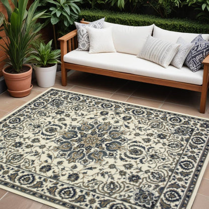 7' X 10' Ivory and Blue Oriental Stain Resistant Indoor Outdoor Area Rug