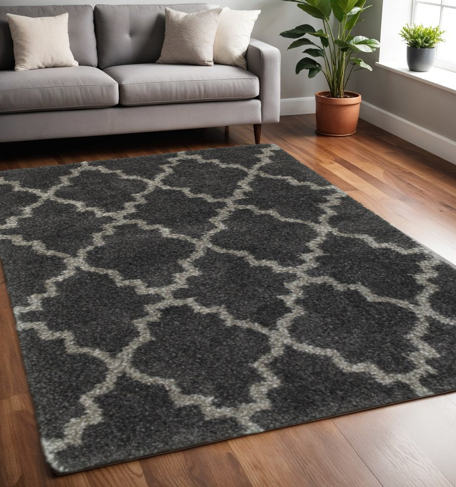 5' X 8' Charcoal And Grey Geometric Shag Power Loom Stain Resistant Area Rug