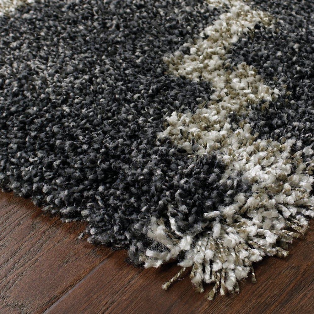 8' X 11' Charcoal And Grey Geometric Shag Power Loom Stain Resistant Area Rug