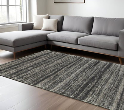 10' X 13' Charcoal Silver And Grey Geometric Shag Power Loom Stain Resistant Area Rug