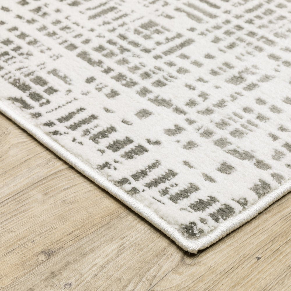 7' X 10' White And Gray Abstract Distressed Area Rug