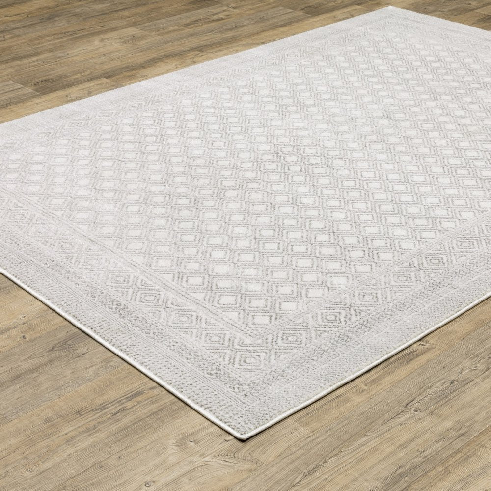 7' X 10' White And Gray Oriental Distressed Area Rug