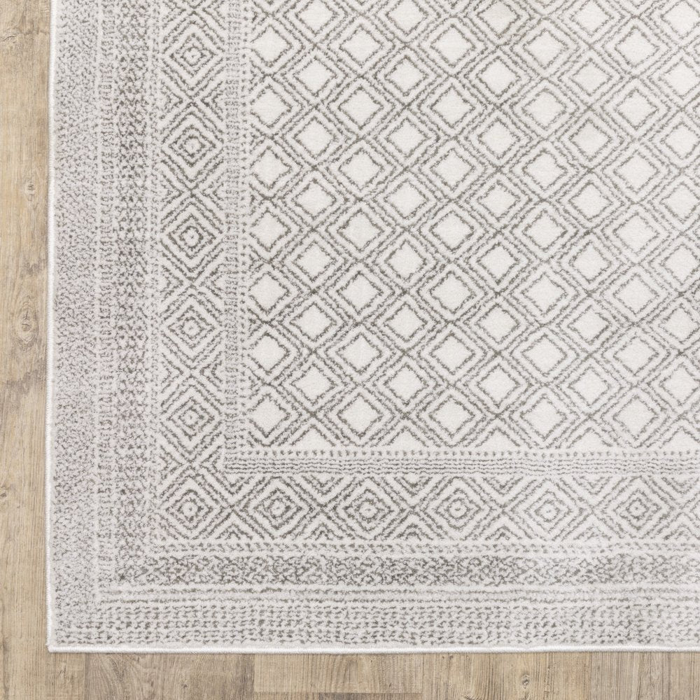 7' X 10' White And Gray Oriental Distressed Area Rug