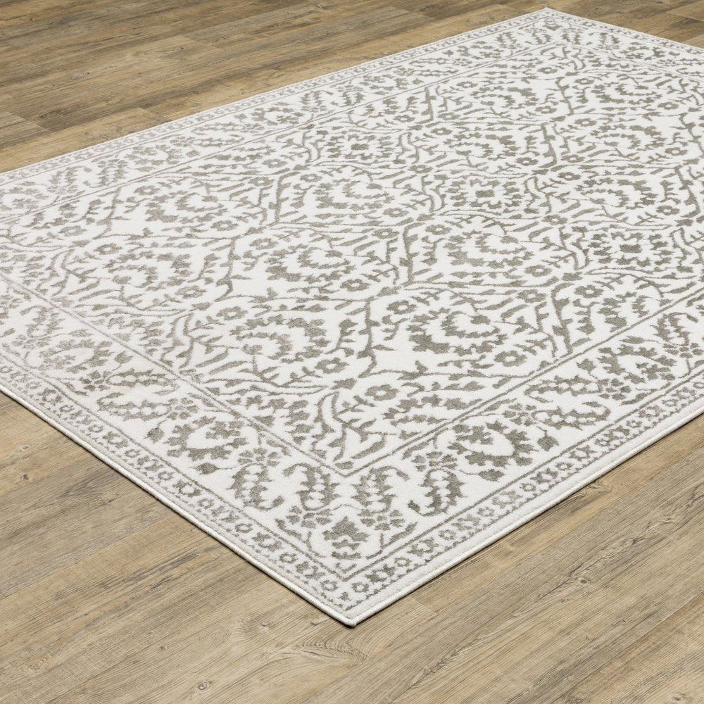 7' X 10' Gray And White Floral Distressed Area Rug