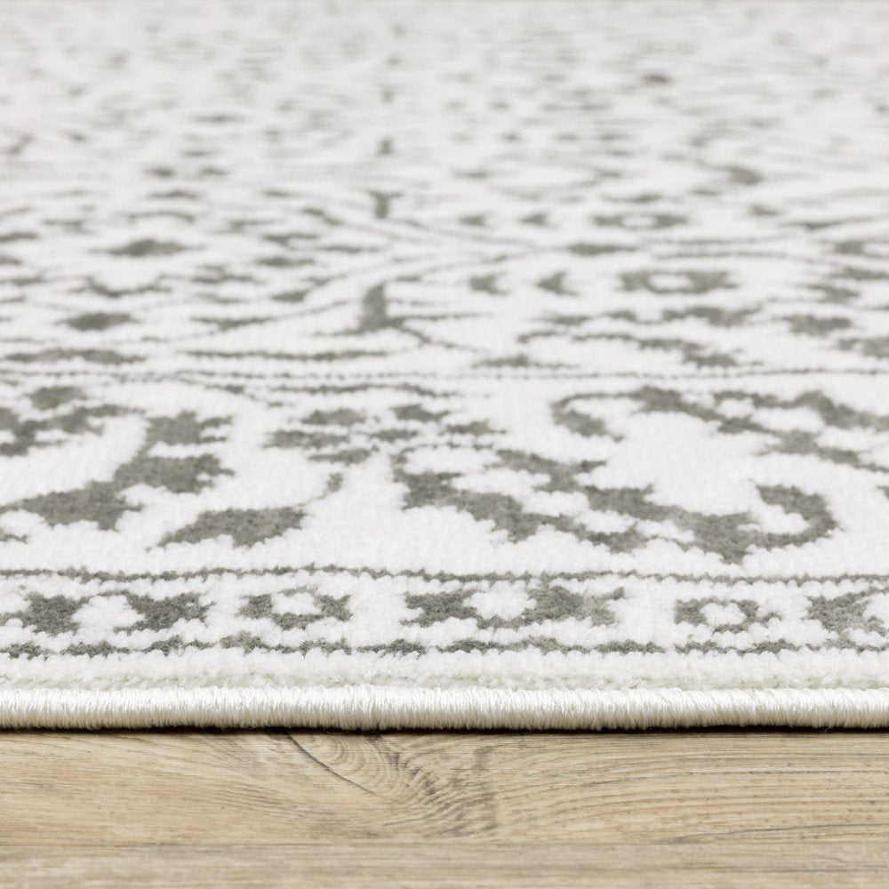 7' X 10' Gray And White Floral Distressed Area Rug
