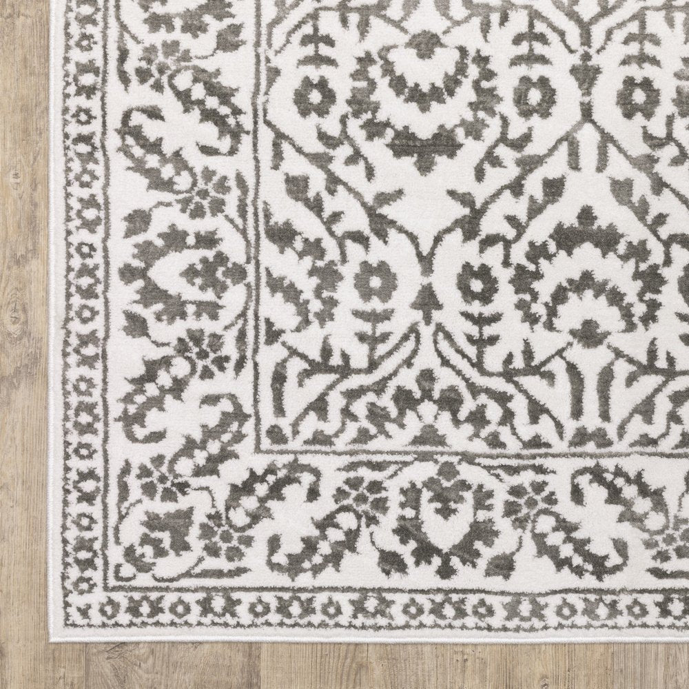 7' X 10' Gray And White Floral Distressed Area Rug
