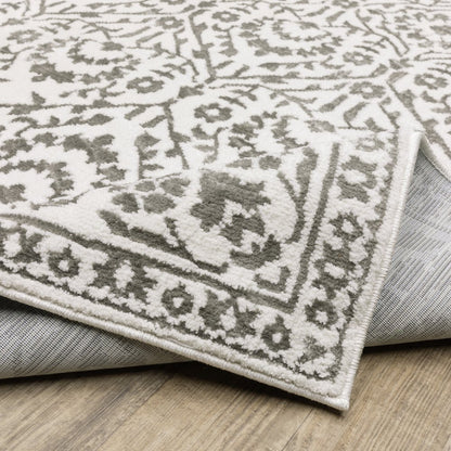 7' X 10' Gray And White Floral Distressed Area Rug