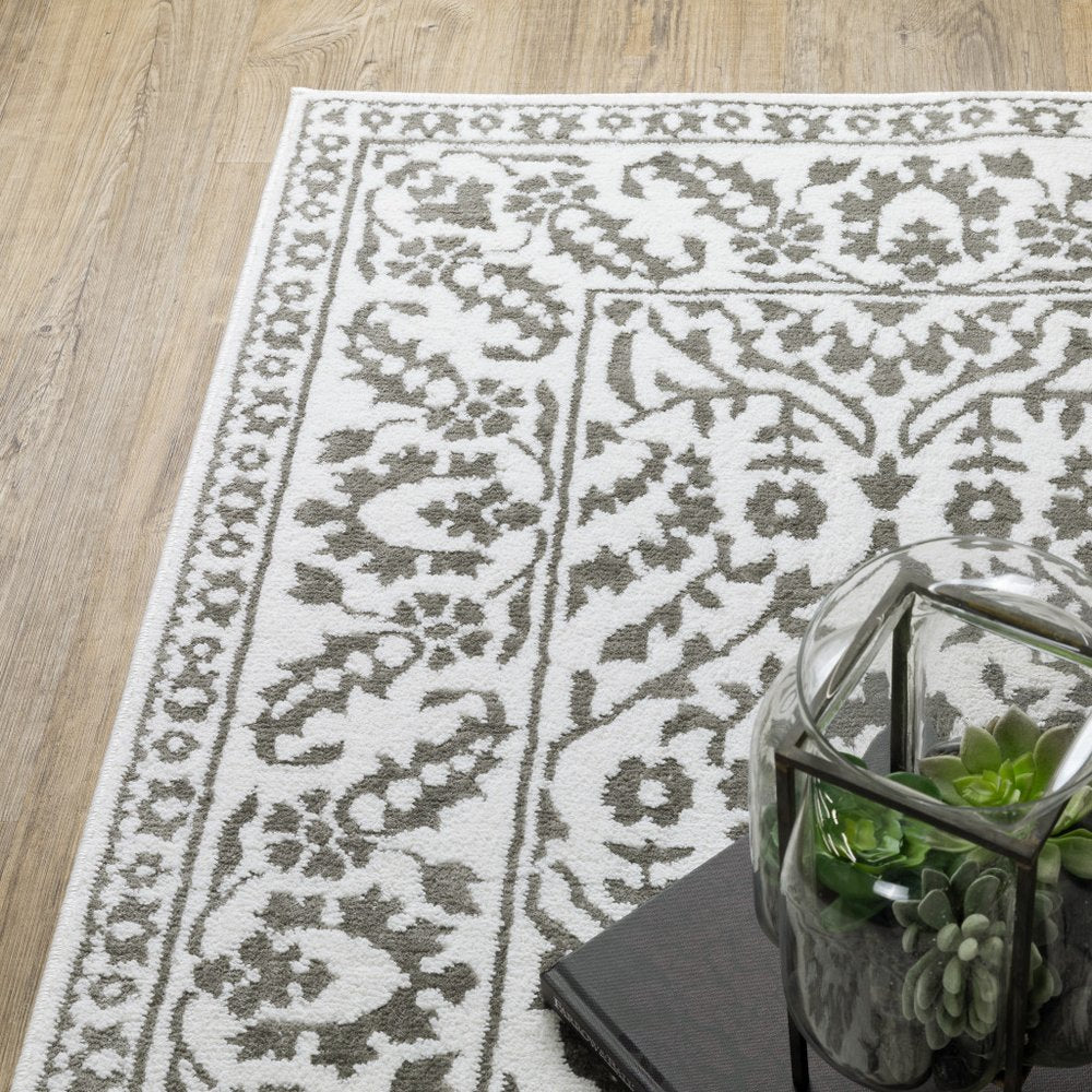 8' X 11' Gray And White Floral Distressed Area Rug