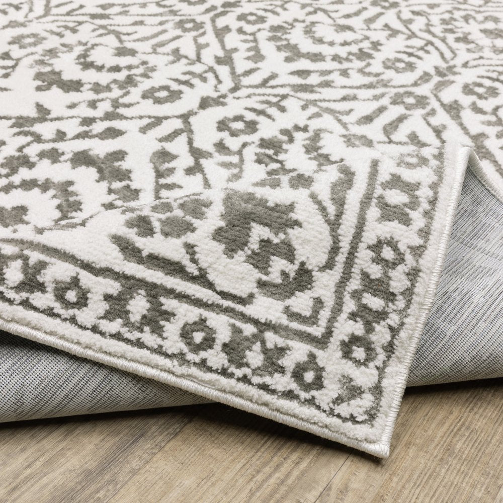 8' X 11' Gray And White Floral Distressed Area Rug