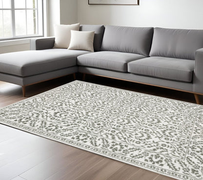 10' X 13' Grey And White Floral Power Loom Stain Resistant Area Rug