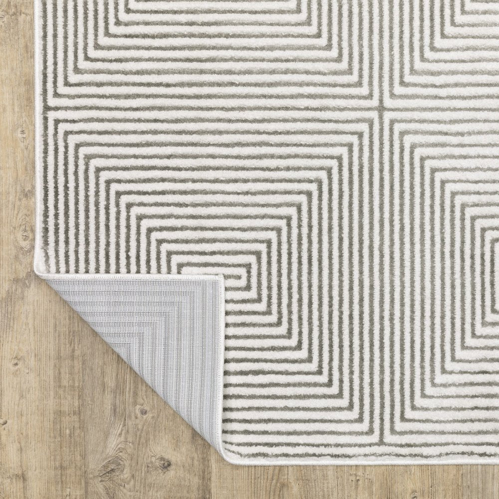 7' X 10' Gray And White Geometric Distressed Area Rug