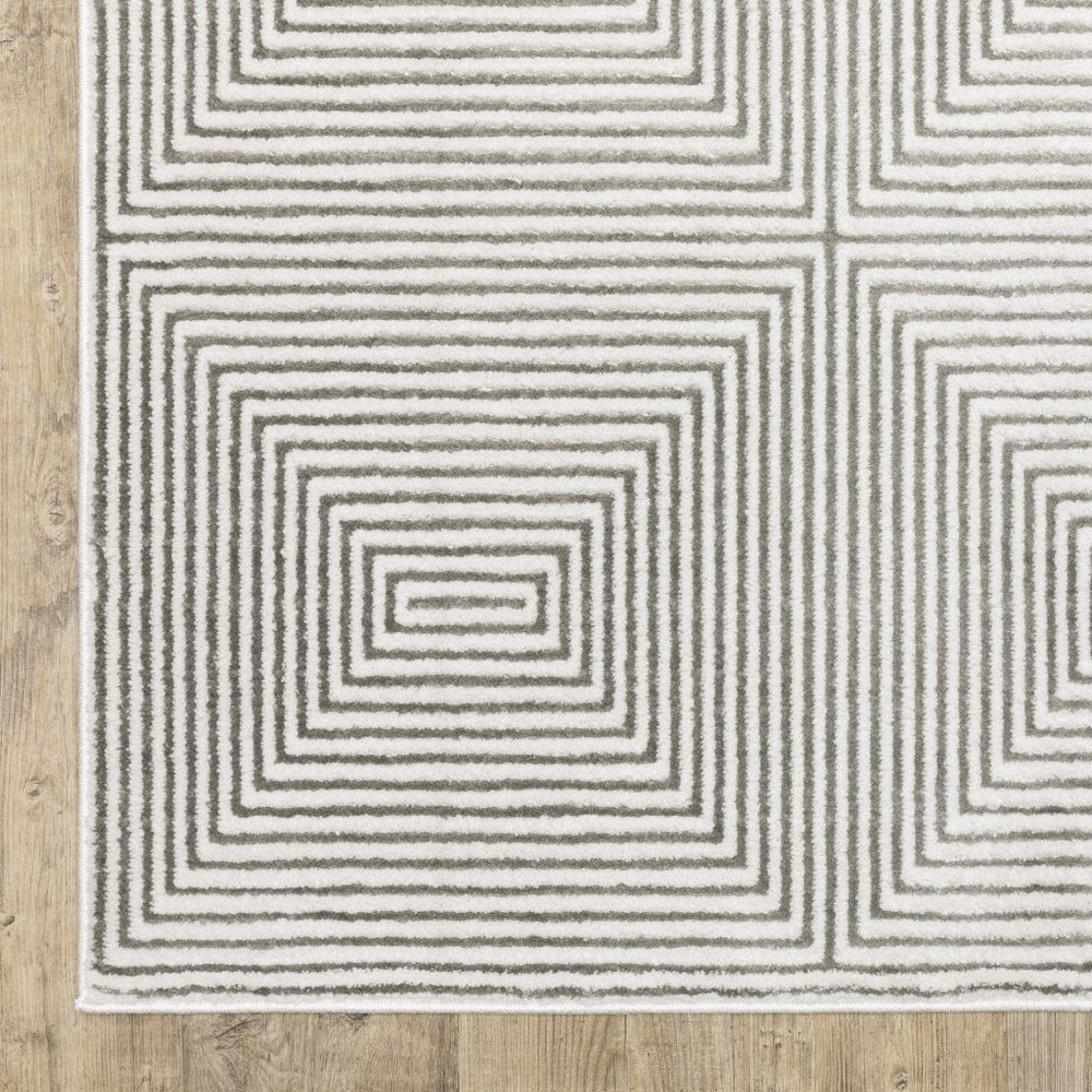 7' X 10' Gray And White Geometric Distressed Area Rug