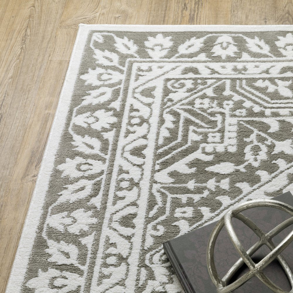 7' X 10' Gray And White Oriental Distressed Area Rug