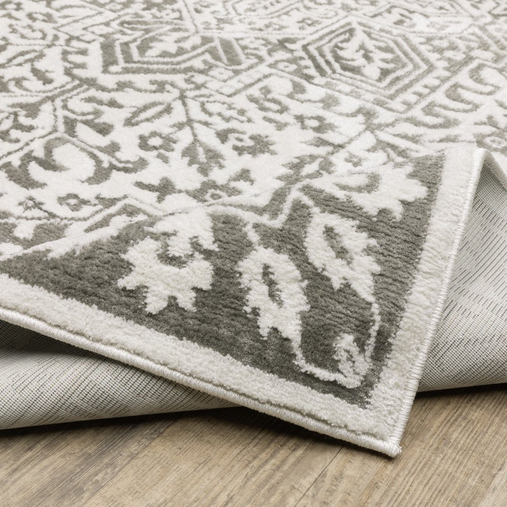 7' X 10' Gray And White Oriental Distressed Area Rug