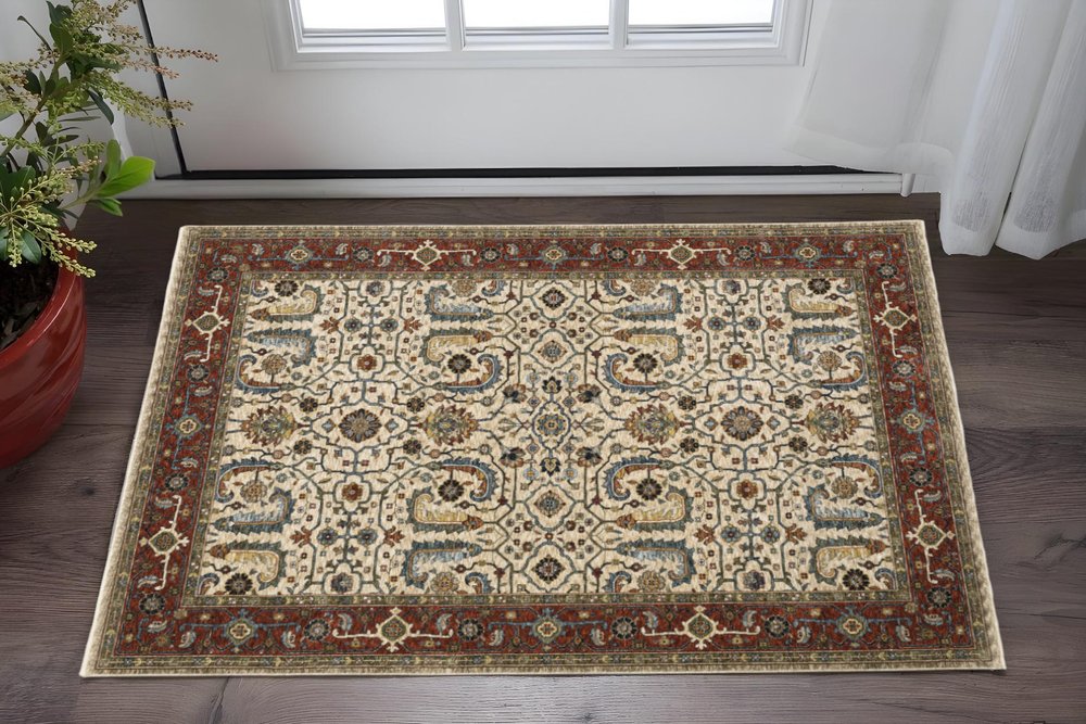 3' X 5' Ivory Red Green Grey Blue And Navy Oriental Power Loom Stain Resistant Area Rug With Fringe