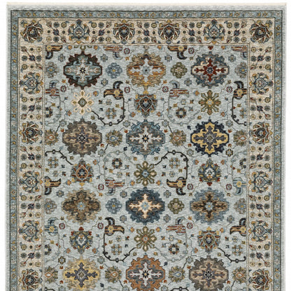 3' X 5' Blue Beige Grey Green Yellow And Rust Oriental Power Loom Stain Resistant Area Rug With Fringe