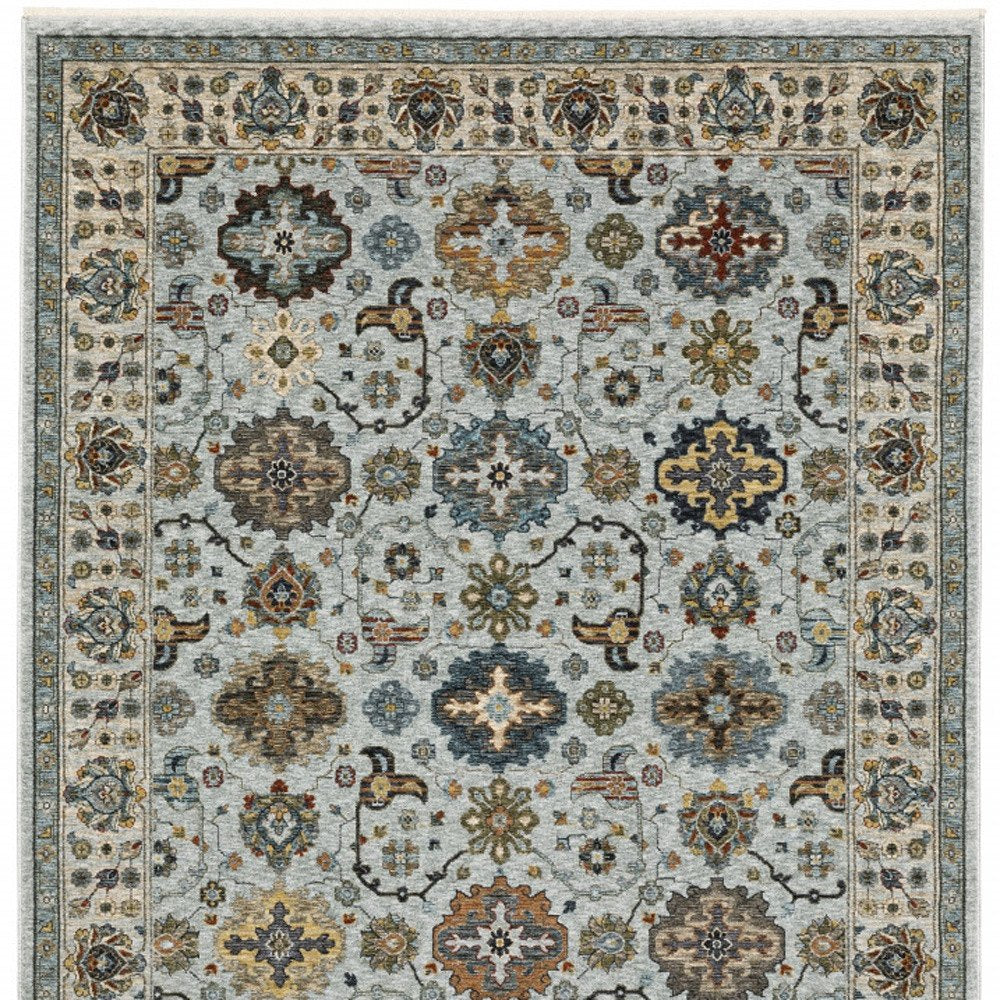 3' X 5' Blue Beige Grey Green Yellow And Rust Oriental Power Loom Stain Resistant Area Rug With Fringe