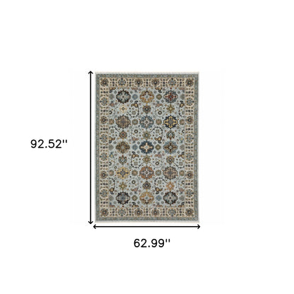 5' X 8' Blue Beige Grey Green Yellow And Rust Oriental Power Loom Stain Resistant Area Rug With Fringe