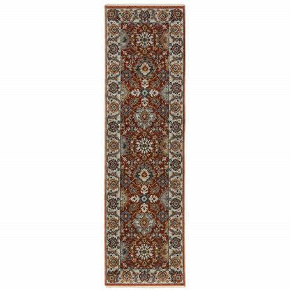 2' X 8' Red Blue Ivory Gold And Navy Oriental Power Loom Stain Resistant Runner Rug With Fringe