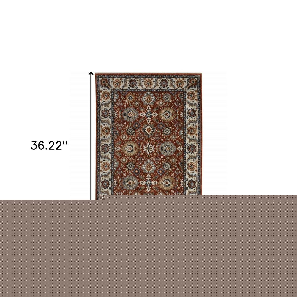 2' X 3' Red Blue Ivory Gold And Navy Oriental Power Loom Stain Resistant Area Rug With Fringe