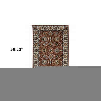 2' X 3' Red Blue Ivory Gold And Navy Oriental Power Loom Stain Resistant Area Rug With Fringe