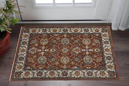 2' X 3' Red Blue Ivory Gold And Navy Oriental Power Loom Stain Resistant Area Rug With Fringe