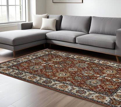 7' X 10' Red Ivory And Orange Oriental Area Rug With Fringe