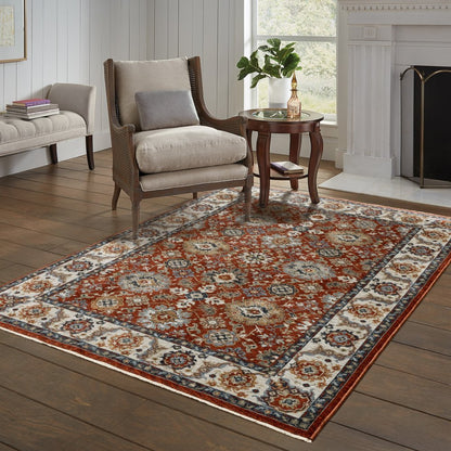 7' X 10' Red Ivory And Orange Oriental Area Rug With Fringe