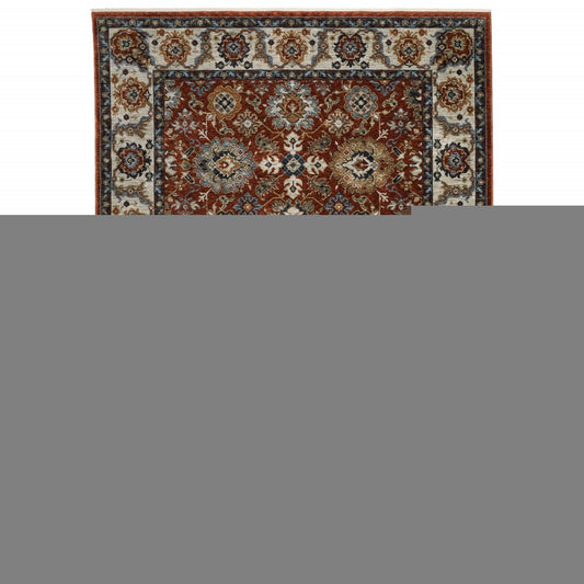 10' X 13' Red Blue Ivory Gold And Navy Oriental Power Loom Stain Resistant Area Rug With Fringe