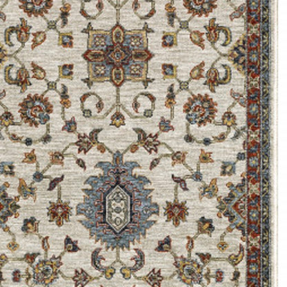 2' X 8' Beige Rust Red Blue Gold And Grey Oriental Power Loom Stain Resistant Runner Rug With Fringe