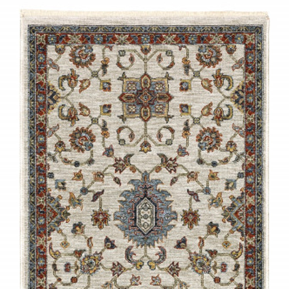 2' X 8' Beige Rust Red Blue Gold And Grey Oriental Power Loom Stain Resistant Runner Rug With Fringe