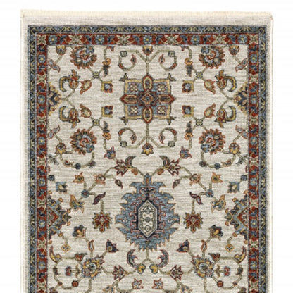 2' X 8' Beige Rust Red Blue Gold And Grey Oriental Power Loom Stain Resistant Runner Rug With Fringe