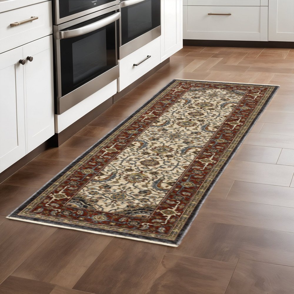 2' X 8' Ivory Beige Red Blue Gold Green And Navy Oriental Power Loom Stain Resistant Runner Rug With Fringe