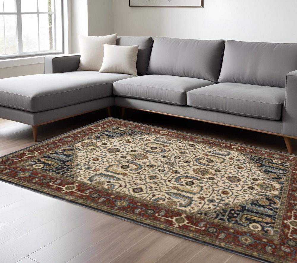 10' X 13' Ivory Beige Red Blue Gold Green And Navy Oriental Power Loom Stain Resistant Area Rug With Fringe