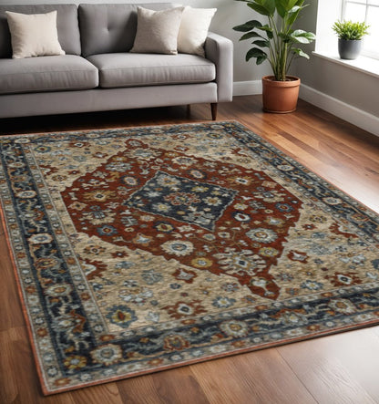 5' X 8' Blue Beige Tan Brown Gold And Rust Red Oriental Power Loom Stain Resistant Area Rug With Fringe